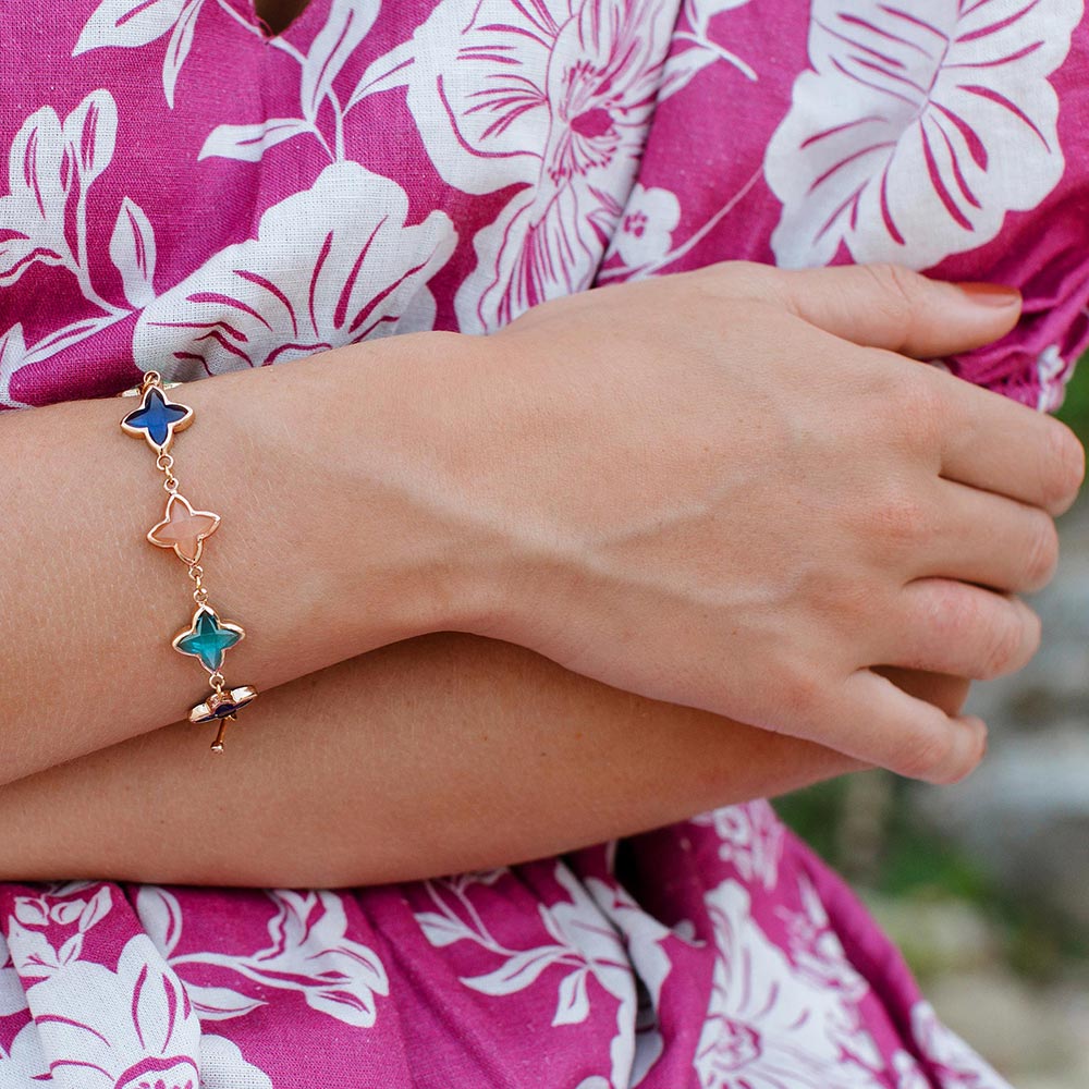 Ginni colourful clover flower bracelet close up arms round waist