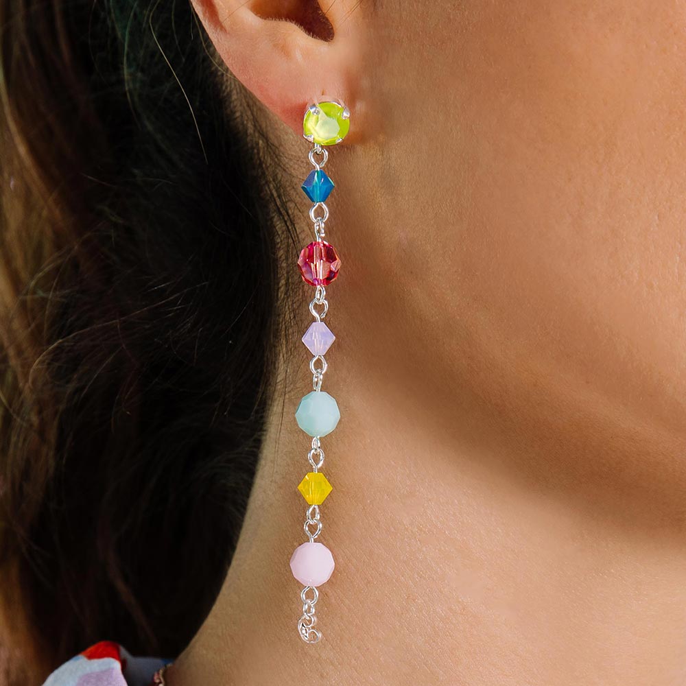 Gelato pastel colour crystal earrings worn long close up on right ear